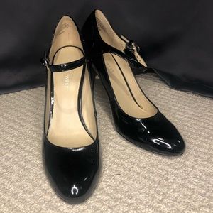 Black leather pumps with ankle straps